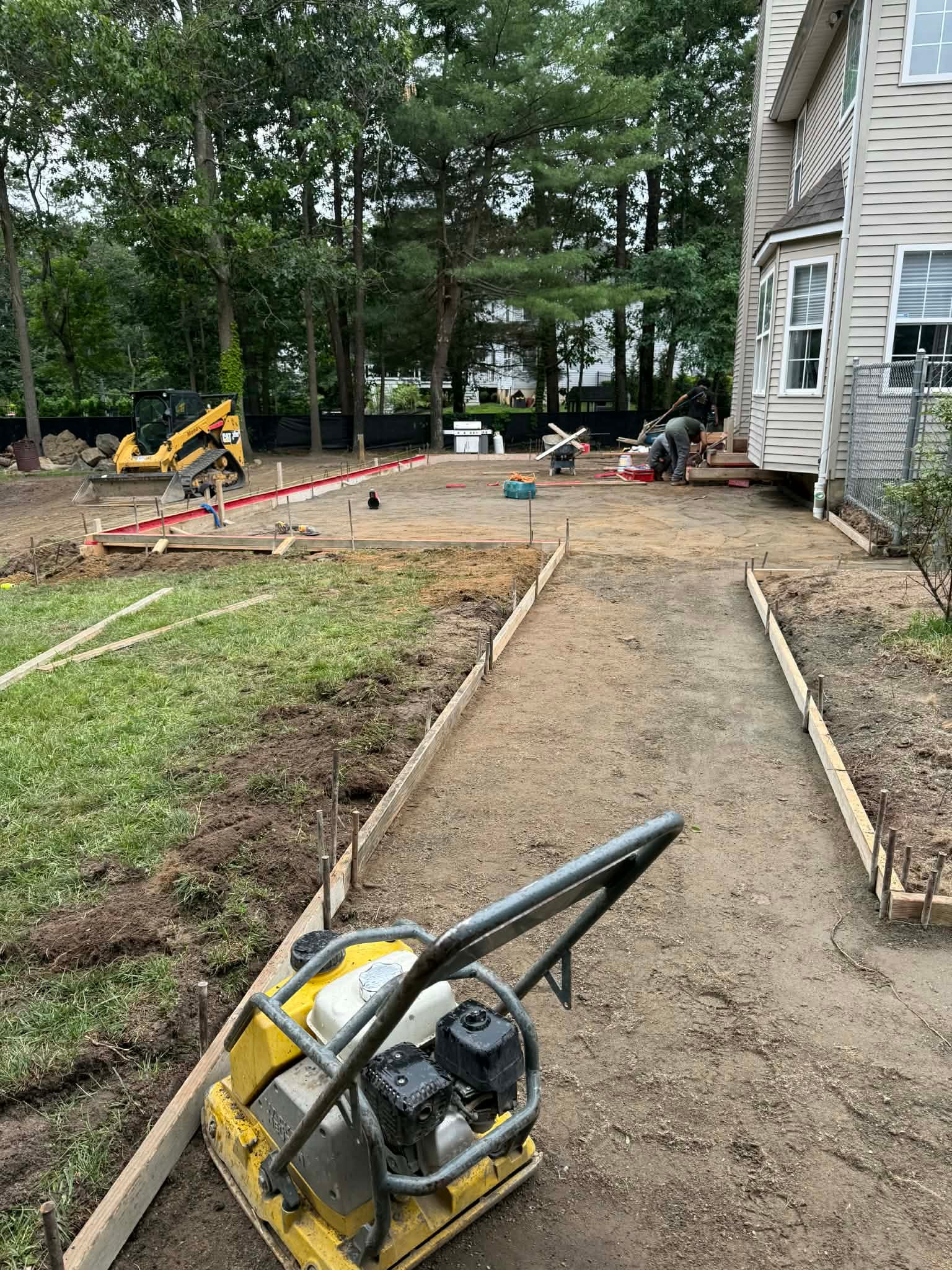Stamped concrete site preparation — forms and compaction